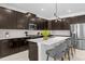 Modern kitchen with dark cabinetry and island at 4370 Rhyme St, Kissimmee, FL 34746