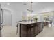 Modern kitchen with large island and breakfast bar at 4370 Rhyme St, Kissimmee, FL 34746