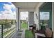 Private balcony with patio furniture and view at 4741 Clock Tower Dr # 306, Kissimmee, FL 34746