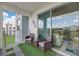 Private balcony with patio furniture and a view at 4741 Clock Tower Dr # 306, Kissimmee, FL 34746