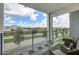 Private balcony overlooking a tree-lined street at 4741 Clock Tower Dr # 306, Kissimmee, FL 34746