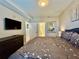 Main bedroom with a king-size bed and dresser at 4741 Clock Tower Dr # 306, Kissimmee, FL 34746