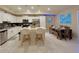 Modern kitchen with stainless steel appliances and island at 4741 Clock Tower Dr # 306, Kissimmee, FL 34746