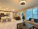 Open concept living space with kitchen and dining area at 4741 Clock Tower Dr # 306, Kissimmee, FL 34746