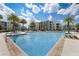 Relaxing community pool with ample deck space at 4741 Clock Tower Dr # 306, Kissimmee, FL 34746