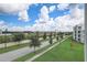 View of tree-lined street and neighboring buildings at 4741 Clock Tower Dr # 306, Kissimmee, FL 34746