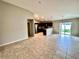 Open concept dining area with tile flooring and access to backyard at 505 Pentas Ln, Haines City, FL 33844