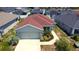 Charming single-Gathering home featuring a two-car garage and neatly landscaped front yard at 505 Pentas Ln, Haines City, FL 33844