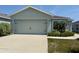Charming home with a two-car garage and well manicured landscaping with curb appeal at 505 Pentas Ln, Haines City, FL 33844