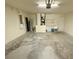 A spacious garage with a utility sink and storage space at 505 Pentas Ln, Haines City, FL 33844