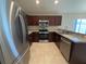 Modern kitchen featuring stainless steel appliances, granite countertops, and ample cabinet space for storage at 505 Pentas Ln, Haines City, FL 33844