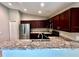 Kitchen with stainless steel appliances and granite countertops at 505 Pentas Ln, Haines City, FL 33844