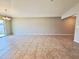 Spacious living room featuring tile floors and neutral walls perfect for entertaining or relaxing at 505 Pentas Ln, Haines City, FL 33844