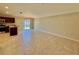 Spacious living room featuring tile floors and neutral walls perfect for entertaining or relaxing at 505 Pentas Ln, Haines City, FL 33844