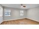 Bright bedroom with hardwood floors and two windows at 616 Se 31St Ter, Ocala, FL 34471