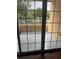 Private balcony with view of trees and parking at 6413 Astor Village # 210, Orlando, FL 32835