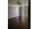 Living room with hardwood floors and sliding glass doors at 6413 Astor Village # 210, Orlando, FL 32835