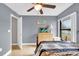 Bedroom with a full-size bed and large window at 667 Heraldo Ct, Kissimmee, FL 34758