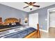 Bedroom with a queen-size bed and double door closet at 667 Heraldo Ct, Kissimmee, FL 34758
