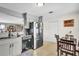 Eat-in kitchen with stainless steel appliances and granite countertops at 667 Heraldo Ct, Kissimmee, FL 34758