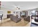 Spacious living room with plenty of seating and a treadmill at 667 Heraldo Ct, Kissimmee, FL 34758