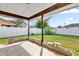 Covered patio with tile floor and small yard at 667 Heraldo Ct, Kissimmee, FL 34758