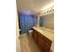 Bathroom with granite countertop vanity and shower/tub combo at 710 Michigan Ct # 2, St Cloud, FL 34769