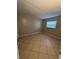 Bright bedroom with tile flooring and window coverings at 710 Michigan Ct # 2, St Cloud, FL 34769