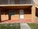 Exterior view of condo building, showing the entrance to unit 2 at 710 Michigan Ct # 2, St Cloud, FL 34769