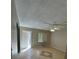 Living room with tile flooring, ceiling fan, and access to patio at 710 Michigan Ct # 2, St Cloud, FL 34769
