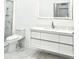 Bathroom with floating vanity and marble shower at 8296 Portofino Dr # 102, Davenport, FL 33896