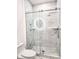 Bathroom with marble shower and frameless glass enclosure at 8296 Portofino Dr # 102, Davenport, FL 33896