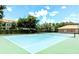 Community tennis court with light blue surface at 8296 Portofino Dr # 102, Davenport, FL 33896