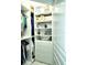 Organized walk-in closet with shelving and drawers at 8296 Portofino Dr # 102, Davenport, FL 33896