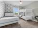 Bedroom with a full-size bed, bunk beds, and rainbow wallpaper at 8985 Stinger Dr, Davenport, FL 33896