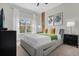 Comfortable bedroom with large windows and plenty of light at 8985 Stinger Dr, Davenport, FL 33896