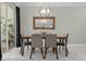 Elegant dining room with a wood table and six chairs at 8985 Stinger Dr, Davenport, FL 33896