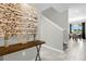 Bright and airy entryway with modern console table and artwork at 8985 Stinger Dr, Davenport, FL 33896