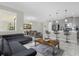 Open floor plan with modern kitchen and L-shaped living room at 8985 Stinger Dr, Davenport, FL 33896