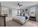 Large main bedroom with a king bed and ensuite bath at 8985 Stinger Dr, Davenport, FL 33896