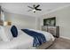 King-size bed, dresser, and TV in this main bedroom at 8985 Stinger Dr, Davenport, FL 33896