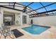 Private screened pool and patio with seating area at 8985 Stinger Dr, Davenport, FL 33896