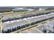 Aerial view of townhouses near a main road and school at 1254 Wispy Cypress Dr, Kissimmee, FL 34746