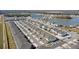 Aerial view of a large community featuring townhouses and a lake at 1254 Wispy Cypress Dr, Kissimmee, FL 34746