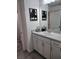 Bathroom with vanity, sink, and gray tiled floor at 1254 Wispy Cypress Dr, Kissimmee, FL 34746