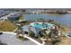 Community pool with clubhouse, playground, and lake views at 1254 Wispy Cypress Dr, Kissimmee, FL 34746