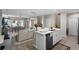 Open concept kitchen and living area with neutral color palette at 1254 Wispy Cypress Dr, Kissimmee, FL 34746