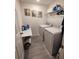 Laundry room with washer, dryer, and overhead storage at 1254 Wispy Cypress Dr, Kissimmee, FL 34746