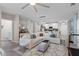 Living room features a sectional sofa and access to kitchen at 1254 Wispy Cypress Dr, Kissimmee, FL 34746