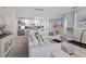 Open concept living area with large sectional sofa and kitchen view at 1254 Wispy Cypress Dr, Kissimmee, FL 34746